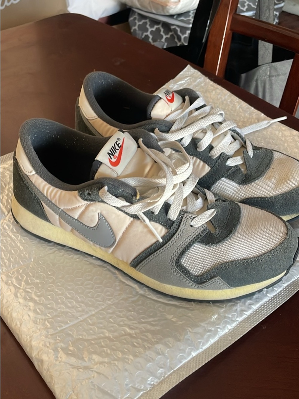 Nike Air Vengeance sneakers featuring a white mesh upper with dark grey and neut